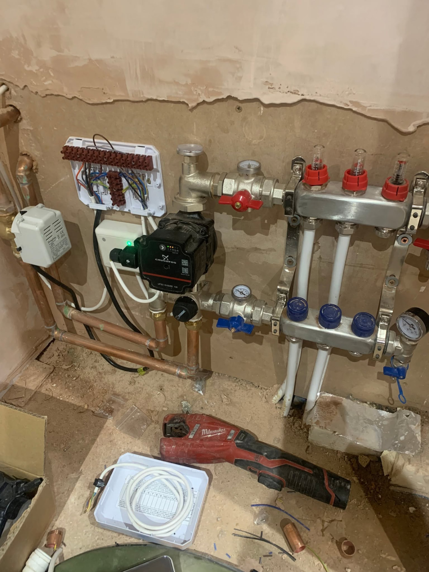Underfloor heating manifold and connected pipework